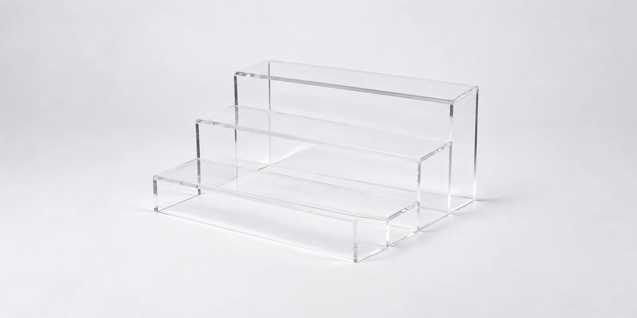 Compact tiered acrylic display stand for countertops